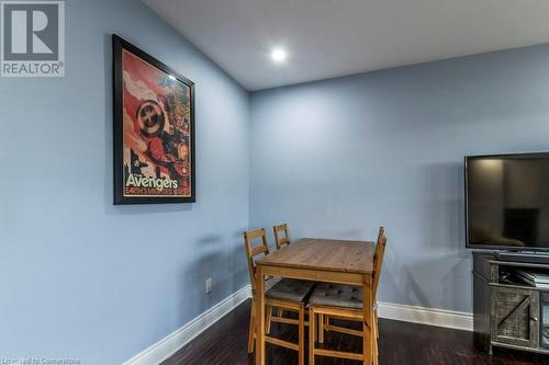 Dining room with dark wood-type flooring - 48 Windom Road Unit# E, Kitchener, ON 