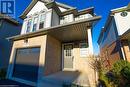 View of front of home featuring a garage - 418 White Birch Avenue, Waterloo, ON 