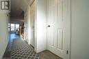 Hallway with dark hardwood / wood-style floors - 418 White Birch Avenue, Waterloo, ON 