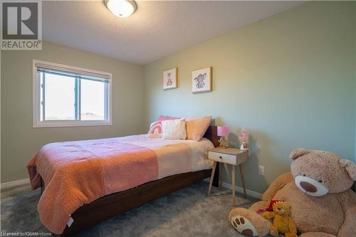 Carpeted bedroom with a textured ceiling - 418 White Birch Avenue, Waterloo, ON 