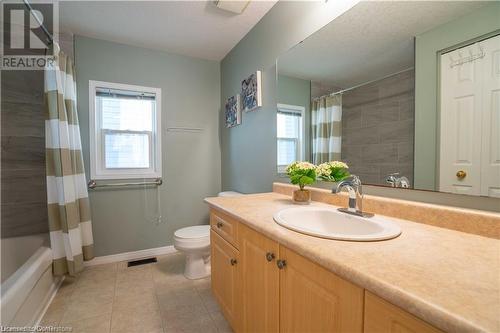 Full bathroom with tile patterned flooring, vanity, a textured ceiling, and toilet - 418 White Birch Avenue, Waterloo, ON 