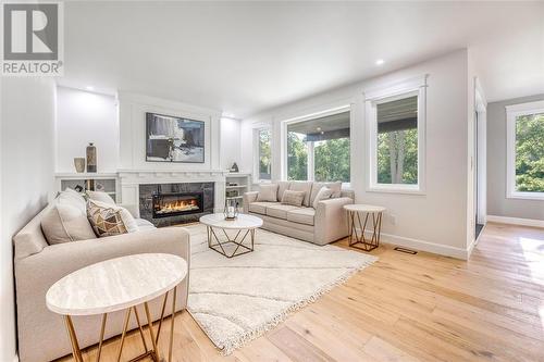 7007 Blue Coast Heights, Plympton-Wyoming, ON - Indoor Photo Showing Living Room With Fireplace