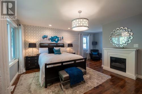 2987 St Clair Parkway, St Clair, ON - Indoor Photo Showing Bedroom With Fireplace