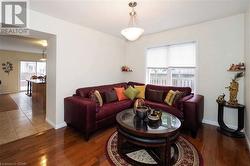 Living room featuring dark hardwood / wood-style floors - 