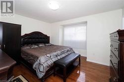 Bedroom featuring dark hardwood / wood-style floors - 