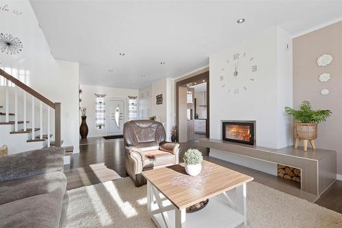 14 Sterling Drive, Mitchell, MB - Indoor Photo Showing Living Room With Fireplace