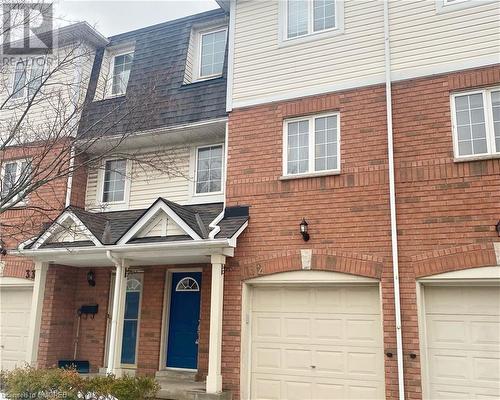 Townhome / multi-family property featuring a garage - 710 Spring Gardens Road Unit# 32, Burlington, ON 