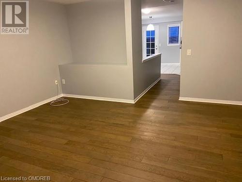 Empty room with dark hardwood / wood-style floors - 710 Spring Gardens Road Unit# 32, Burlington, ON 