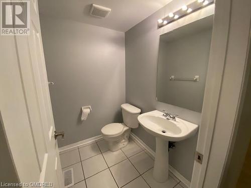 Bathroom featuring tile patterned flooring and toilet - 710 Spring Gardens Road Unit# 32, Burlington, ON 