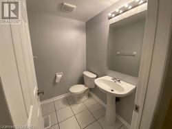 Bathroom featuring tile patterned flooring and toilet - 