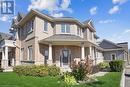 View of front of house with a porch - 21 White Star Lane, Grimsby, ON 