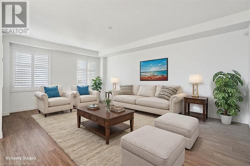 Living room with hardwood / wood-style floors - 21 White Star Lane, Grimsby, ON 