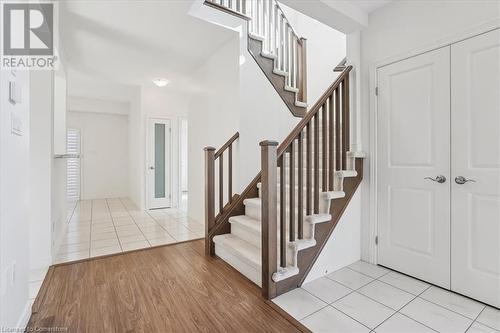 Entrance foyer with light hardwood / wood-style floors - 21 White Star Lane, Grimsby, ON 