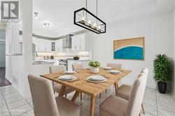 Dining space featuring a notable chandelier and sink - 