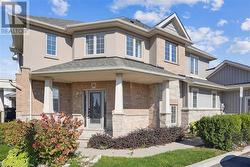 View of front of house featuring a porch - 