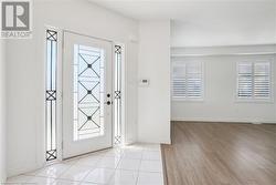 Entrance foyer featuring light wood-type flooring and plenty of natural light - 