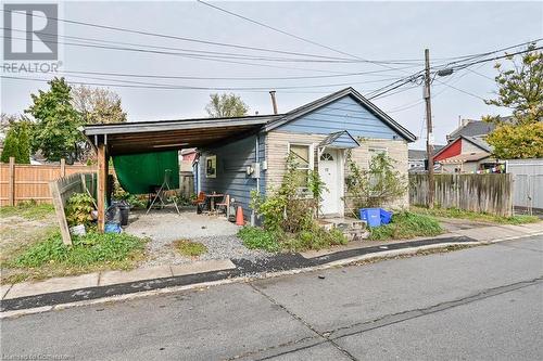 View of front of house featuring a carport - 97 Evans Street, Hamilton, ON 