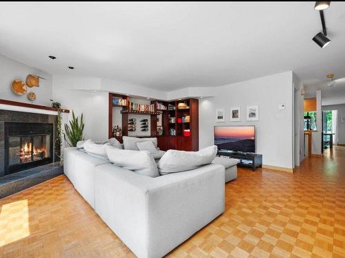 Living room - 11310 Rue Meunier, Montréal (Ahuntsic-Cartierville), QC - Indoor Photo Showing Living Room With Fireplace