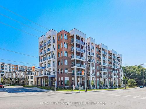 308-125 Canon Jackson Dr, Toronto, ON - Outdoor With Balcony With Facade