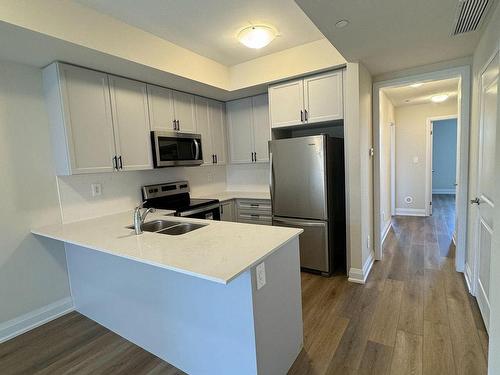 119-1573 Rose Way, Milton, ON - Indoor Photo Showing Kitchen With Double Sink