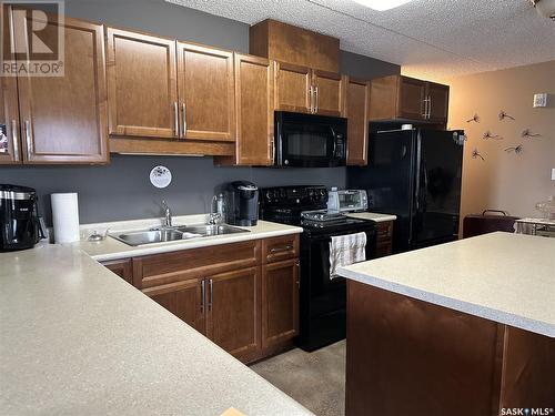 207 505 Bannerman Street, Weyburn, SK - Indoor Photo Showing Kitchen With Double Sink