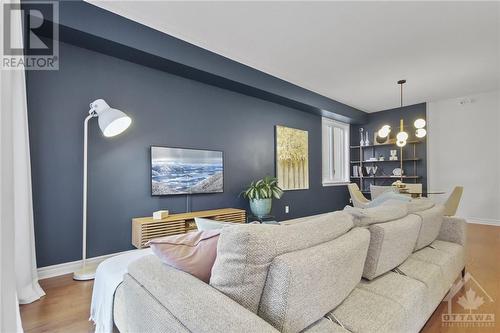 Great accent wall - 109 Wild Senna Way, Ottawa, ON - Indoor Photo Showing Living Room