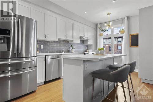 Seating at island. Upgraded appliances - 109 Wild Senna Way, Ottawa, ON - Indoor Photo Showing Kitchen With Upgraded Kitchen