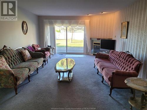 9770 Menard, Windsor, ON - Indoor Photo Showing Living Room With Fireplace