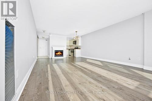 1103 - 10 Dean Park Road, Toronto, ON - Indoor With Fireplace