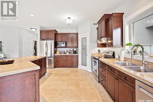 411 Nicklaus Drive, Warman, SK - Indoor Photo Showing Kitchen With Double Sink