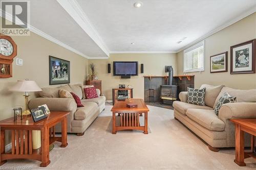 758169 Girl Guide Road, Georgian Bluffs, ON - Indoor Photo Showing Living Room With Fireplace