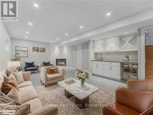 5 Oakwood Avenue, Tiny, ON - Indoor Photo Showing Living Room With Fireplace