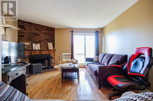 812 - 95 Trailwood Drive, Mississauga, ON - Indoor Photo Showing Living Room With Fireplace