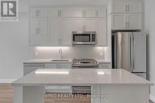 126 - 95 Dundas Street W, Oakville, ON - Indoor Photo Showing Kitchen With Stainless Steel Kitchen With Upgraded Kitchen