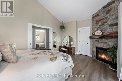 21 Pinery Lane, Georgina, ON - Indoor Photo Showing Bedroom With Fireplace