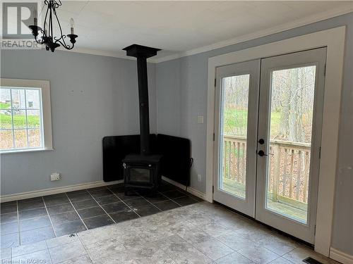 Sitting area with woodstove and views of the ravine - 941 20Th Street W, Georgian Bluffs, ON - Indoor Photo Showing Other Room