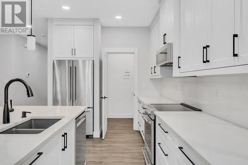 1938 Hemmerling Court, Kelowna, BC - Indoor Photo Showing Kitchen With Double Sink With Upgraded Kitchen