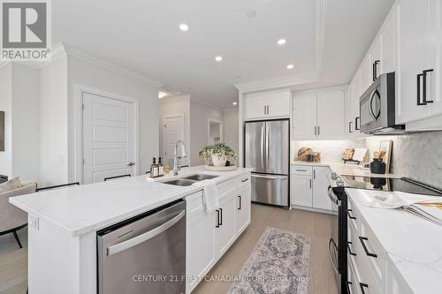 312 - 1560 Upper West Avenue, London, ON - Indoor Photo Showing Kitchen With Stainless Steel Kitchen With Double Sink With Upgraded Kitchen