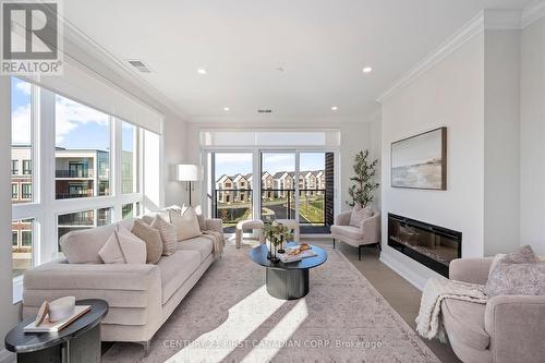 NW corner exposure - 312 - 1560 Upper West Avenue, London, ON - Indoor Photo Showing Living Room With Fireplace