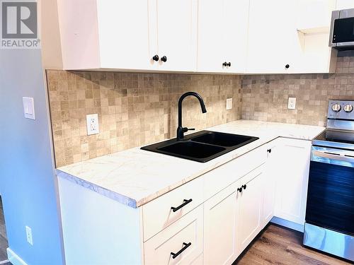 302 10Th Avenue Unit# 106, Invermere, BC - Indoor Photo Showing Kitchen With Double Sink