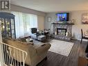 7627 Moncton Crescent, Prince George, BC  - Indoor Photo Showing Living Room With Fireplace 