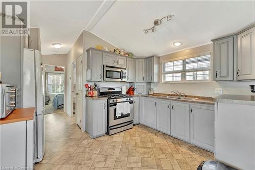 673 Brant-Waterloo Road Unit# 302, Ayr, ON - Indoor Photo Showing Kitchen With Double Sink