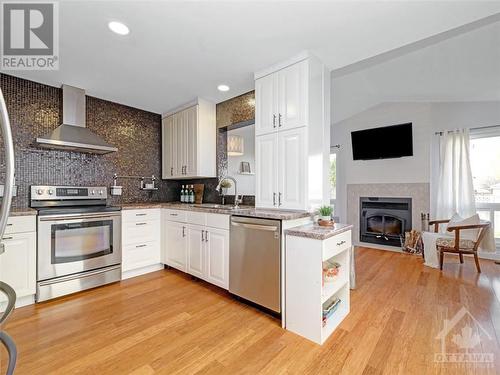 53 Saddlehorn Crescent, Kanata, ON - Indoor Photo Showing Kitchen With Fireplace