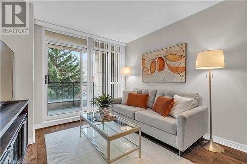 Living room featuring hardwood / wood-style flooring - 2379 Central Park Drive Unit# 206, Oakville, ON - Indoor Photo Showing Living Room