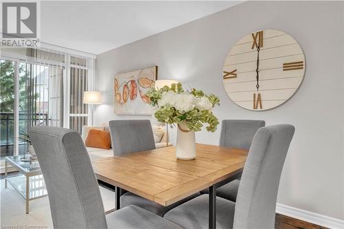 Dining space with hardwood / wood-style floors - 2379 Central Park Drive Unit# 206, Oakville, ON - Indoor Photo Showing Dining Room