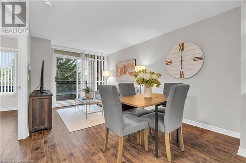 Dining room with dark hardwood / wood-style flooring - 2379 Central Park Drive Unit# 206, Oakville, ON - Indoor Photo Showing Dining Room