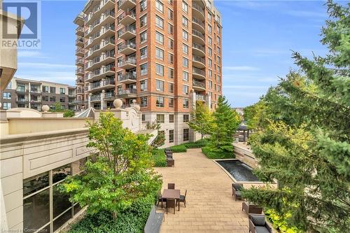 View of property - 2379 Central Park Drive Unit# 206, Oakville, ON - Outdoor With Balcony With Facade