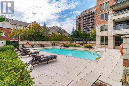 View of pool featuring a patio area - 2379 Central Park Drive Unit# 206, Oakville, ON - Outdoor With In Ground Pool