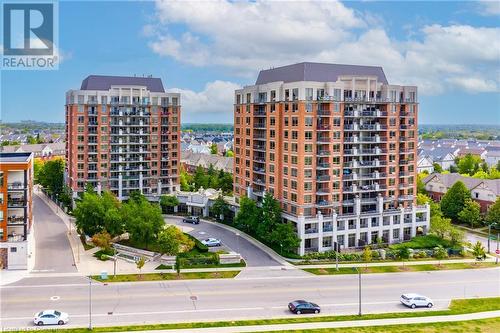 View of property - 2379 Central Park Drive Unit# 206, Oakville, ON - Outdoor With Balcony With Facade