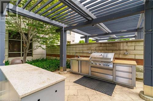 View of patio / terrace featuring a grill, a pergola, sink, and exterior kitchen - 2379 Central Park Drive Unit# 206, Oakville, ON - Outdoor With Exterior